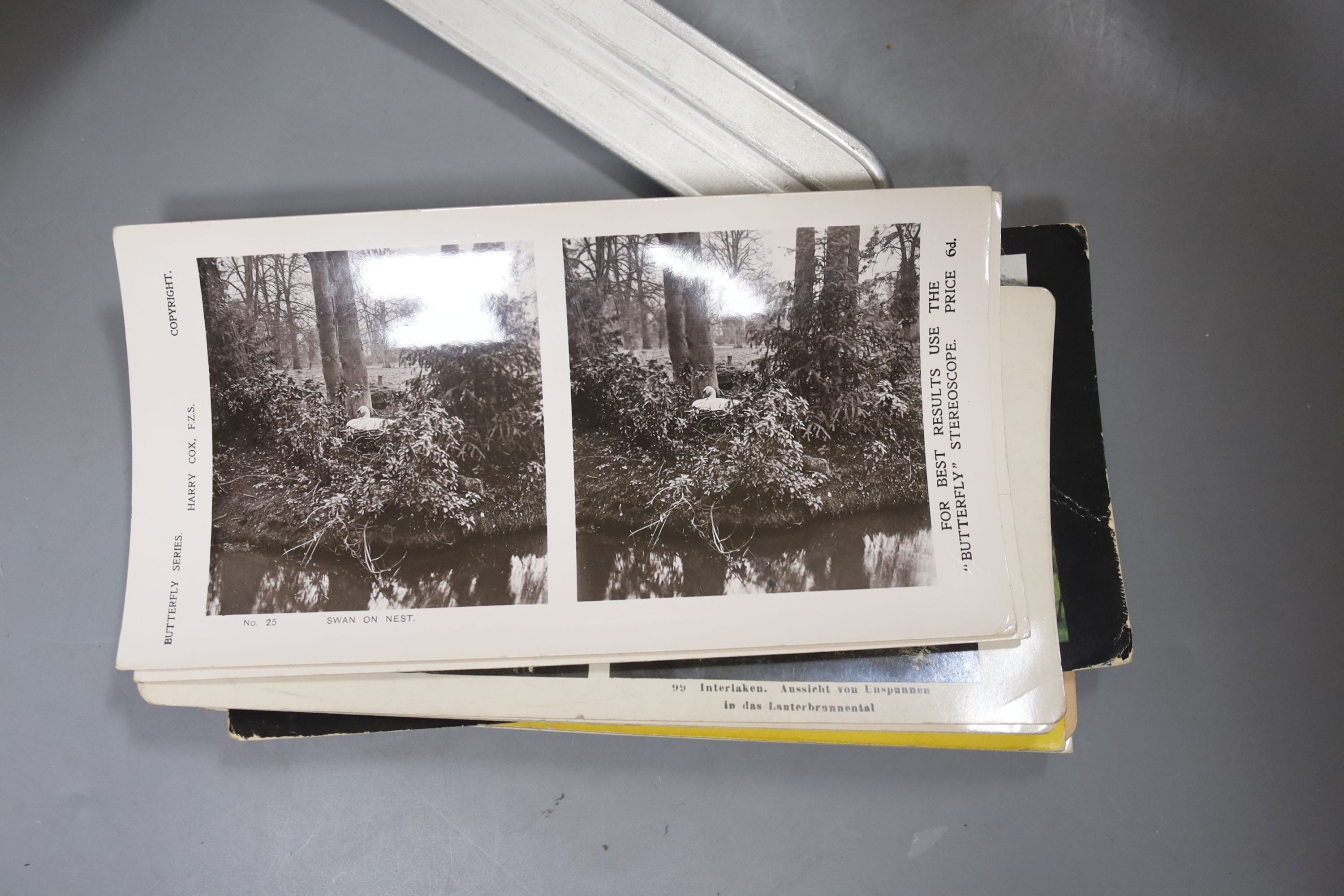 A boxed stereoscopic viewer and collection of cards, viewer 32 cms long.